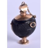 AN ANTIQUE GOLD MOUNTED BOG OAK SCENT BOTTLE. 9 grams. 4 cm high.