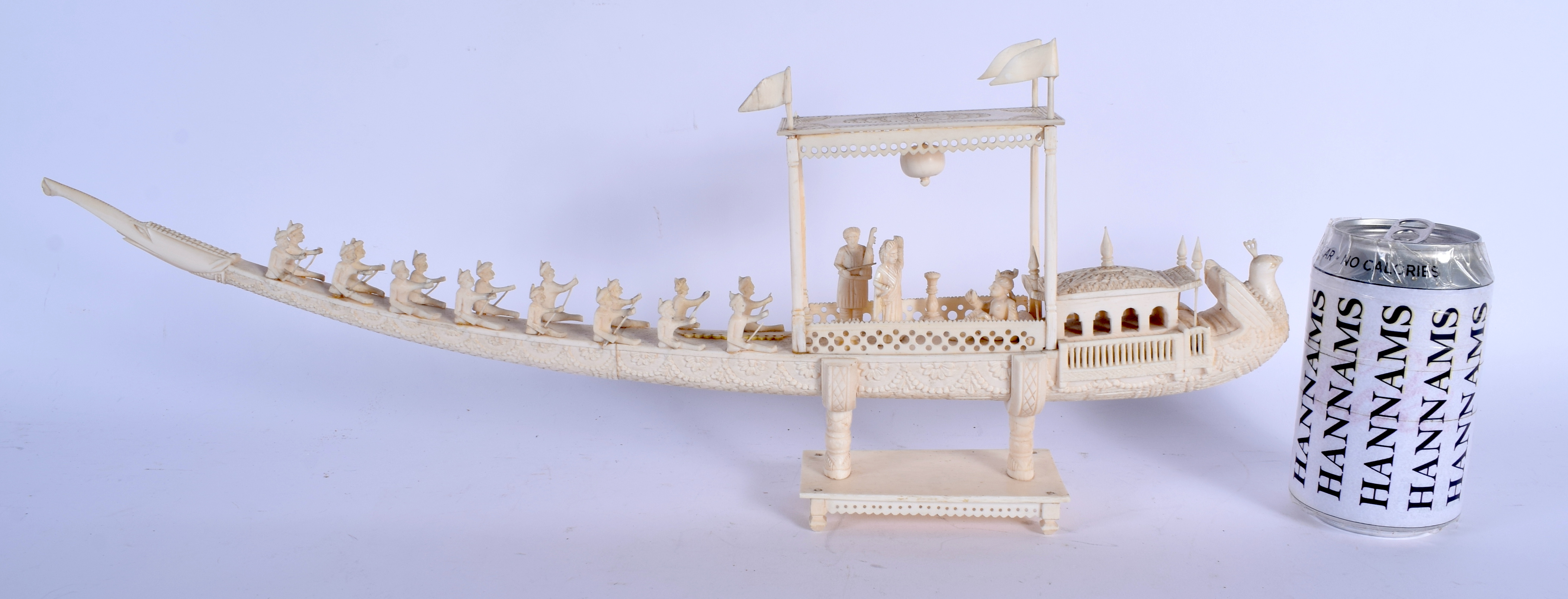 A 19TH CENTURY ANGLO INDIAN CARVED IVORY PROCESSIONAL BOAT decorated with figures and foliage. 45 cm