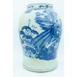 A large early 20th century blue and vase decorated with a phoenix and foliage 38cm.