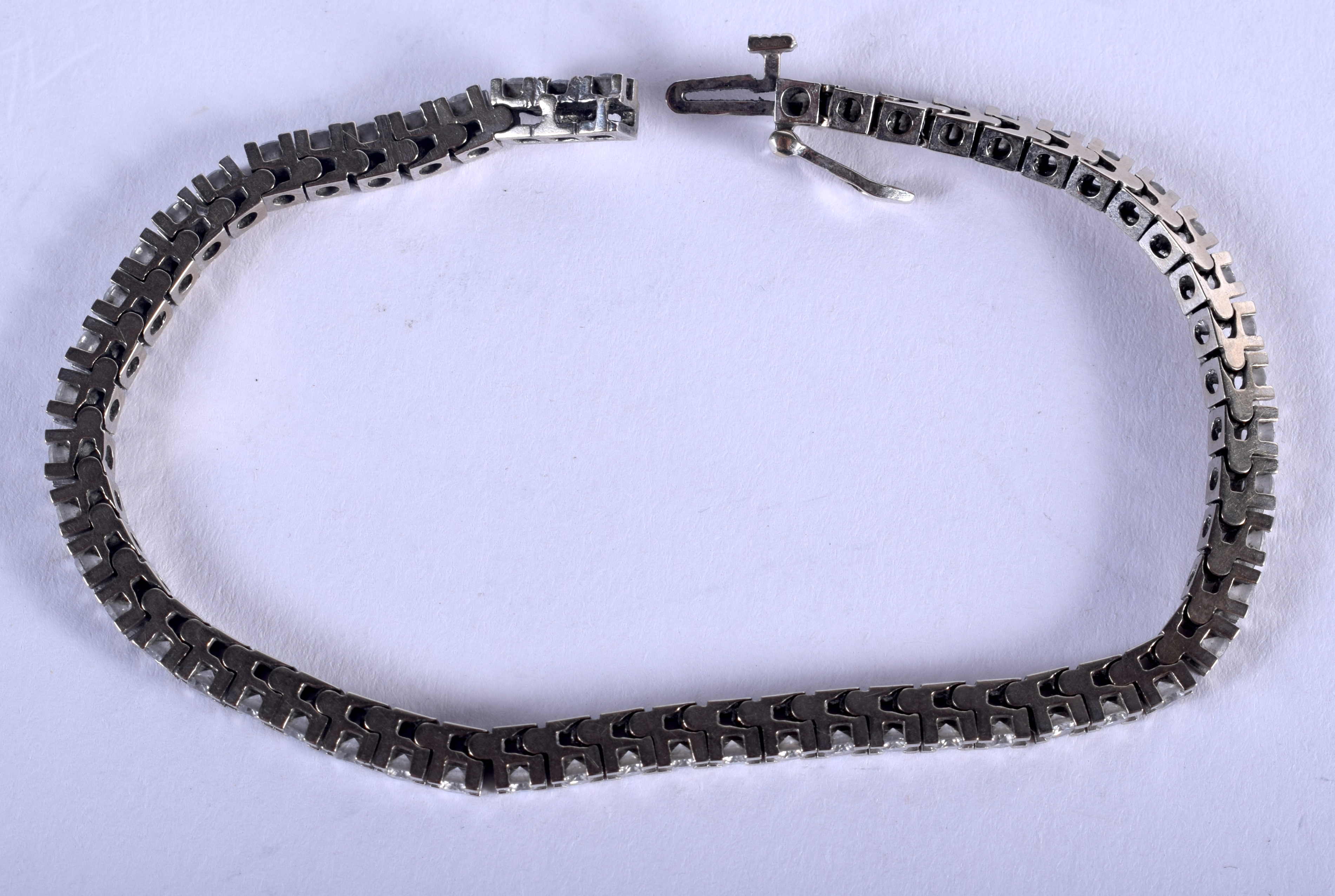 A CHARMING 18CT WHITE GOLD AND DIAMOND TENNIS BRACELET. 15 grams. 20 cm long. - Image 2 of 3