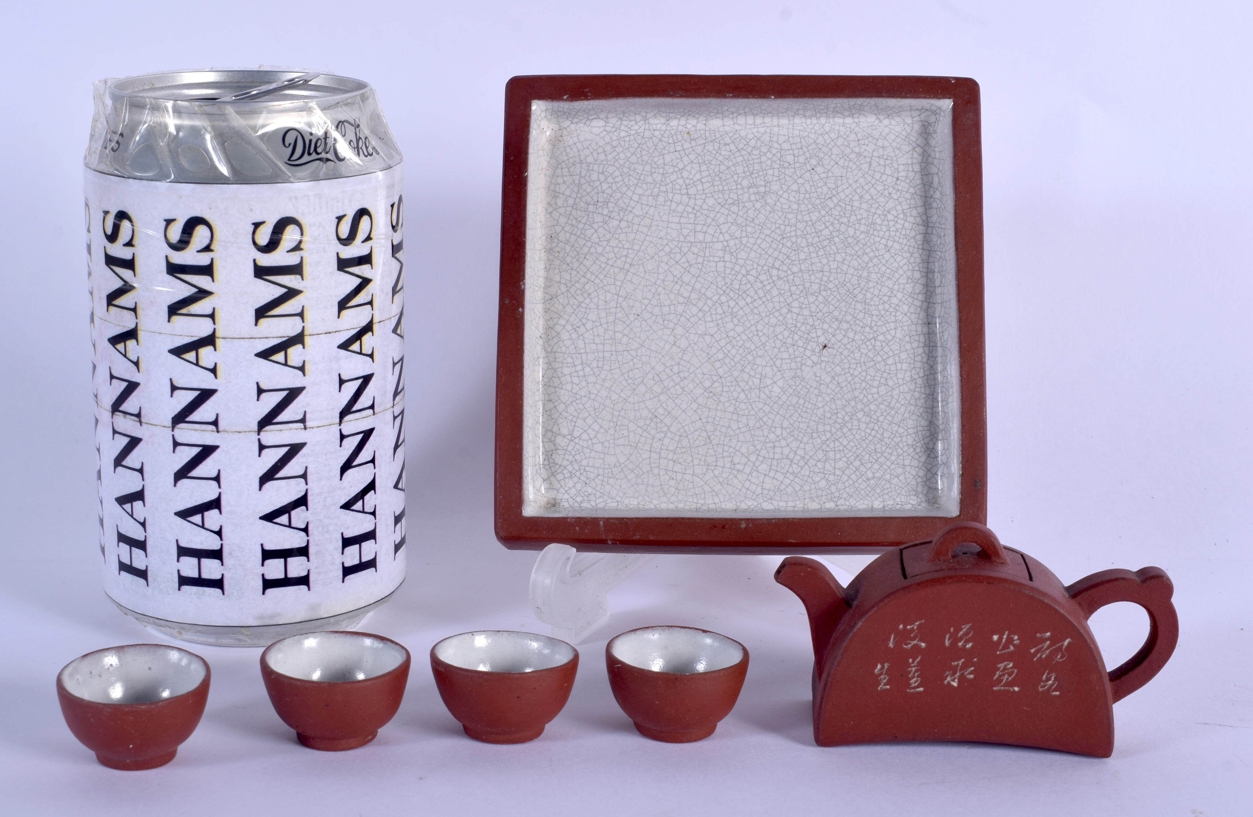 A VERY RARE EARLY 20TH CENTURY CHINESE MINIATURE YIXING TEASET upon a tray. Tray 9.25 cm square. (6)