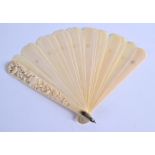 A 19TH CENTURY JAPANESE MEIJI PERIOD CARVED IVORY DIEPPE FAN decorated with foliage and vines. 30 cm