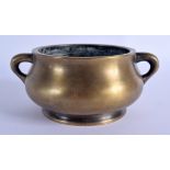 AN 18TH CENTURY CHINESE TWIN HANDLED BRONZE CENSER Qing, bearing Xuande marks to base. 988 grams. 16
