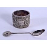 AN ANTIQUE SILVER NAPKIN RING and silver spoon. 53 grams. (2)