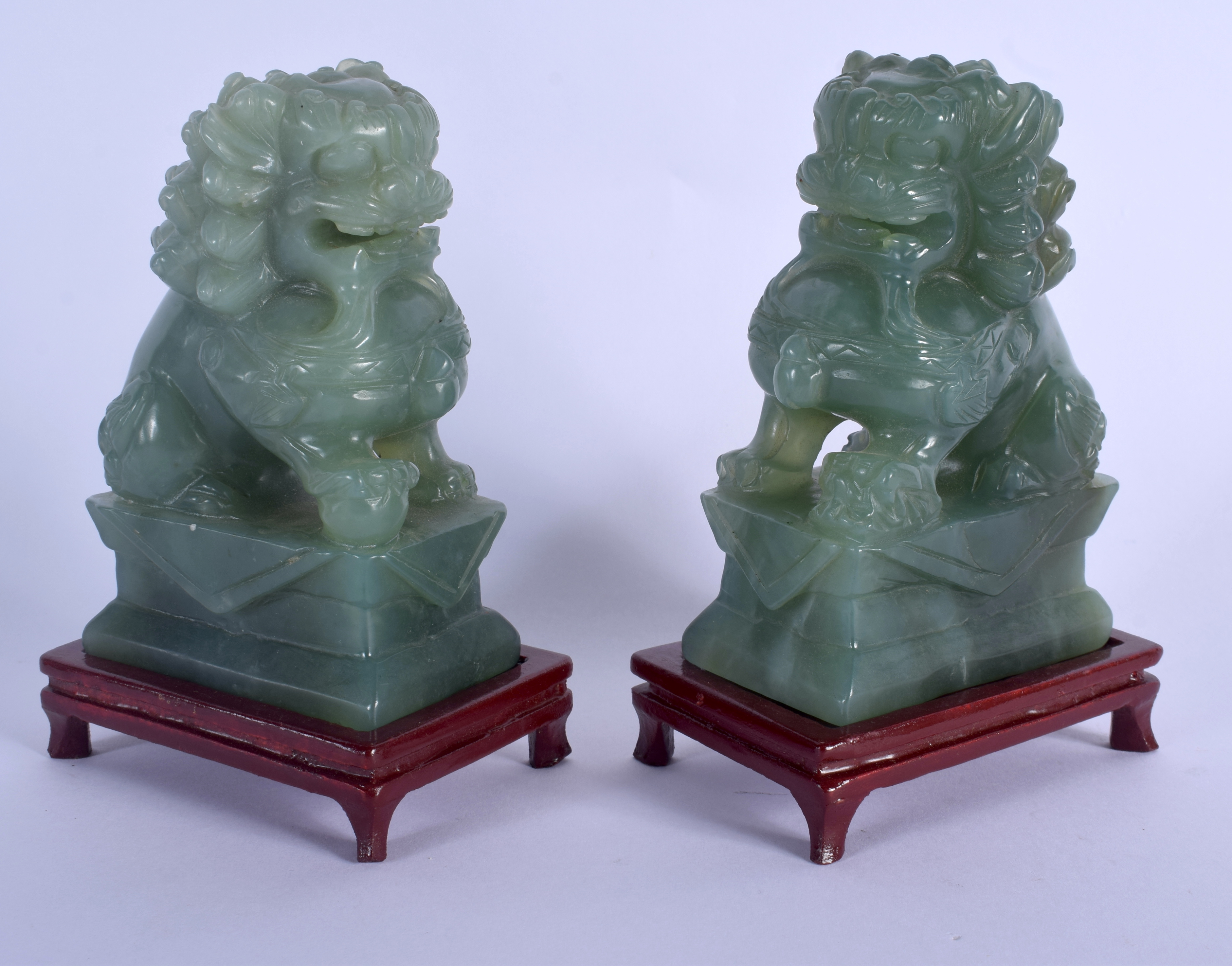 A PAIR OF EARLY 20TH CENTURY CHINESE CARVED JADE FIGURES OF LIONS Late Qing/Republic. Jade 12 cm x 6