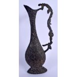 A 19TH CENTURY MIDDLE EASTERN ISLAMIC BRONZE EWER decorated with foliage. 29 cm high.