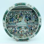 A Chinese 20th century Famille Verte dish depicting a gathering of females 28 x 5cm.