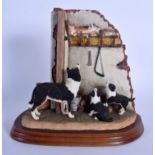 A BORDER FINE ARTS FIGURE OF LETS BE FRIENDS modelled as three dogs. 21 cm x 15 cm.