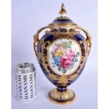 Royal Crown Derby large vase and cover finely painted with flowers in a gilt panel on a cobalt blue