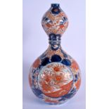 A 19TH CENTURY JAPANESE MEIJI PERIOD IMARI BULBOUS PORCELAIN VASE painted with foliage. 27 cm high.