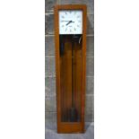 A wooden cased Gents Electric Pulsynetic master clock 129cm.