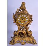 A MID 19TH CENTURY FRENCH ORMOLU MANTEL CLOCK modelled as a young boy emerging from a landscape, upo