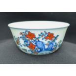 A Chinese tea bowl decorated with a chicken 8 x 3.5 cm.