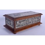A FINE 19TH CENTURY ANGLO INDIAN SILVERED STEEL AND HARDWOOD CASKET decorated with elephants and lan