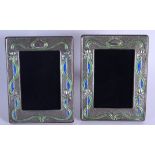 A PAIR OF SILVER AND ENAMEL ART NOUVEAU TYPE PHOTOGRAPH FRAMES. 20 cm x 14 cm.