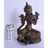 A 19TH CENTURY TIBETAN INDIAN HIMALAYAN BRONZE BUDDHISTIC DEITY modelled upon a shaped base. 30 cm x