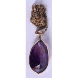 A GOLD MOUNTED AMETHYST NECKLACE. 13 grams. 56 cm long, pendant 4 cm x 1.5 cm.