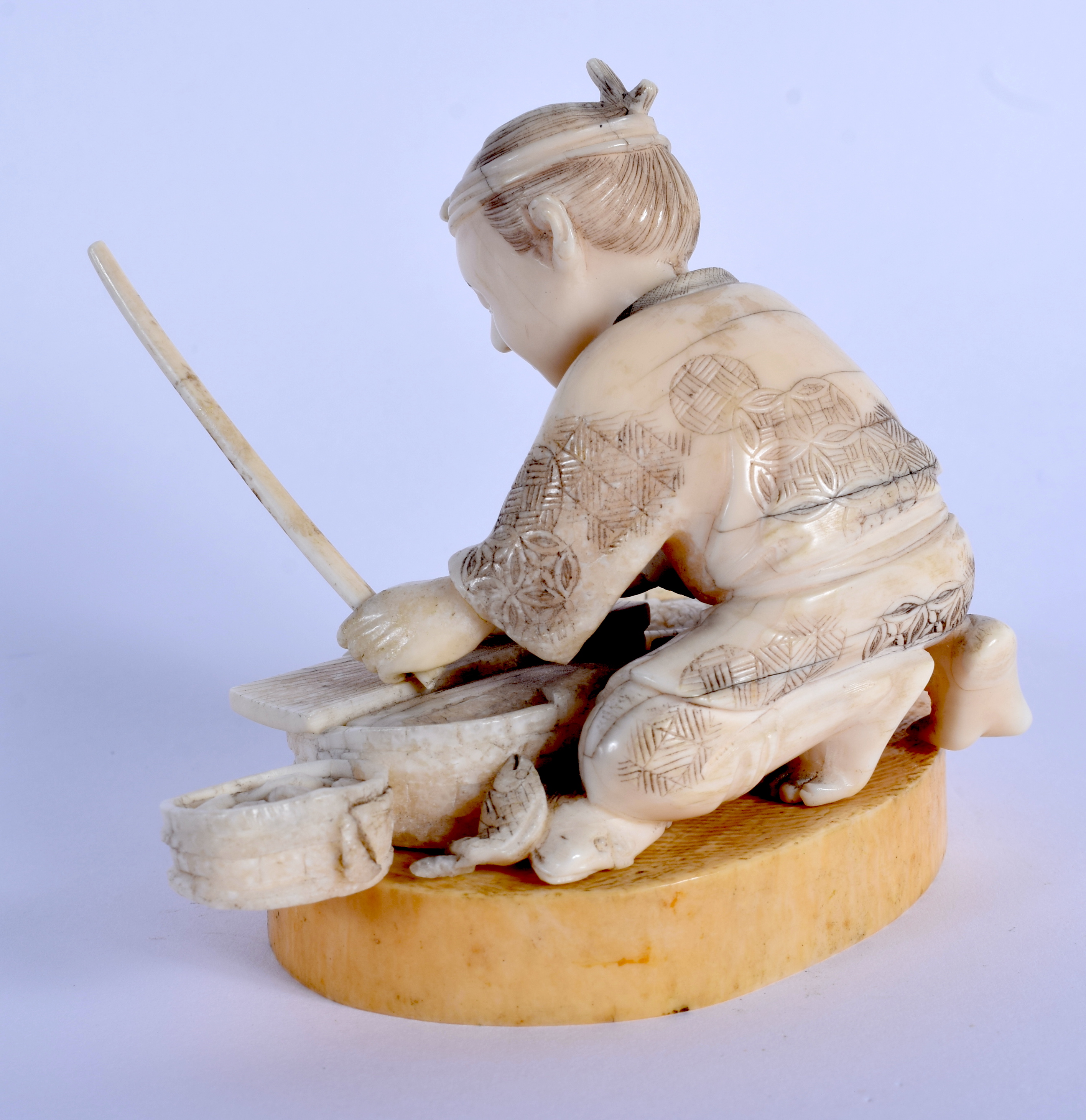 A 19TH CENTURY JAPANESE MEIJI PERIOD CARVED BONE FIGURE OF A MALE modelled preparing fish. 8 cm x 9 - Image 2 of 4