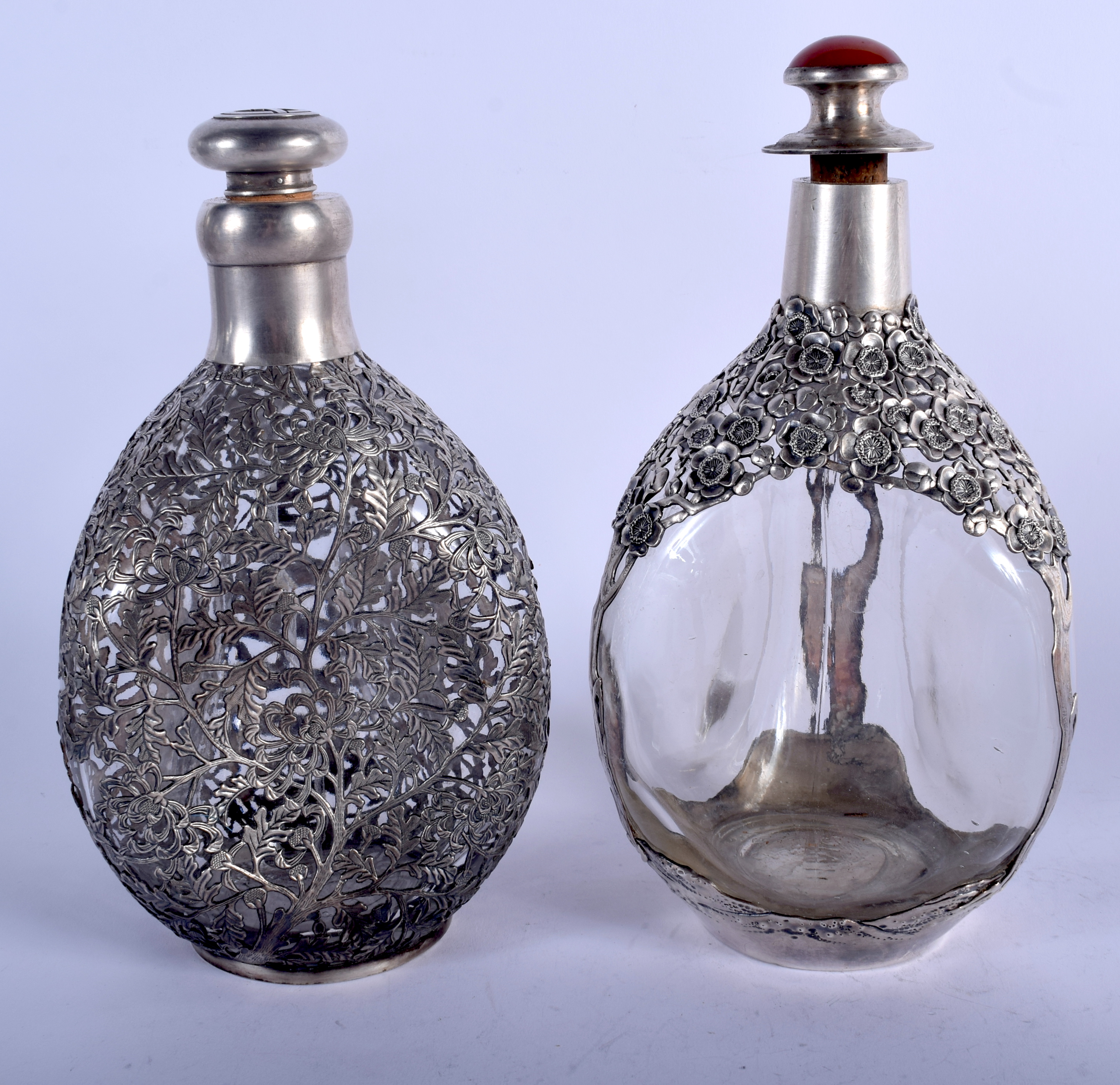 TWO EARLY 20TH CENTURY CHINESE EXPORT SILVER OVERLAID WHISKEY DECANTERS decorated with flowers. 800 - Bild 2 aus 4