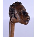 AN UNUSUAL EARLY 20TH CENTURY CARVED BAMBOO ROOTWOOD WALKING CANE with figural terminal. 83 cm long.