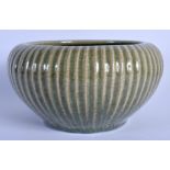 A 19TH CENTURY CHINESE RIBBED CELADON STONEWARE CENSER Qing. 21 cm x 13 cm.