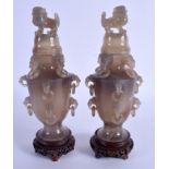 A PAIR OF EARLY 20TH CENTURY CHINESE CARVED AGATE VASES AND COVERS Late Qing/Republic, decorated wit