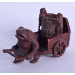 A JAPANESE CARVED WOOD FIGURE OF A TOAD modelled pulling a cart. 8 cm x 4.5 cm.