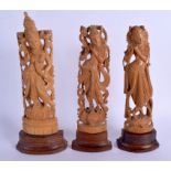 THREE EARLY 20TH CENTURY INDIAN CARVED WOOD BUDDHISTIC FIGURES. Largest 28 cm high. (3)