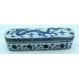 Chinese blue and white lidded porcelain box decorated with a dragon 32.5 x 8 cm .