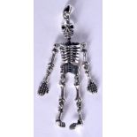 A SILVER SKELETON. 14 grams. 6 cm x 2 cm.