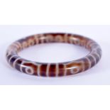 A CHINESE TIBETAN AGATE BANGLE. 6.5 cm wide.