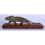 A 19TH CENTURY MIDDLE EASTERN CARVED HORN SCULPTURE OF A ROAMING TIGER upon a wooden base. 21 cm lon