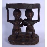 AN UNUSUAL AFRICAN CARVED TRIBAL YORUBA STOOL formed as male and female beside each other. 36 cm x 3