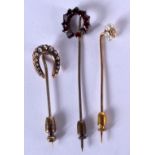 THREE ANTIQUE GOLD STICK PINS. 4 grams. (3)