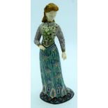 An unusual enamelled metal figure of a European figure of a female 32cm