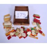 AN ANTIQUE TREEN BOX containing 179 gaming counters. (qty)