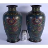 A LARGE PAIR OF 19TH CENTURY CHINESE CHAMPLEVE ENAMEL VASES decorated with flowers and vines. 39 cm