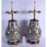 A PAIR OF 1950S CHINESE PORCELAIN FAMILLE ROSE HU VASES converted to lamps. Porcelain 27 cm x 16 cm.