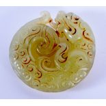 A CHINESE JADE ROUNDEL. 4.5 cm wide.