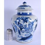 A LARGE 19TH CENTURY CHINESE BLUE AND WHITE PORCELAIN VASE AND COVER Kangxi style, painted with figu