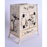 A 19TH CENTURY JAPANESE MEIJI PERIOD CARVED SHIBAYAMA IVORY CABINET decorated with birds and foliage
