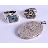 TWO VINTAGE SILVER RINGS and a 1970S silver locket. 27 grams. (3)