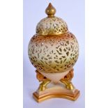 Royal Worcester ovoid vase on three legs finely reticulated and coloured with ivory and blush ivory