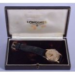 A BOXED 9CT GOLD LONGINES WRISTWATCH. 3.25 cm wide.