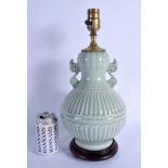 AN EARLY 20TH CENTURY CHINESE TWIN HANDLED CELADON PORCELAIN VASE Late Qing, converted to a lamp. Po