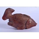 A JAPANESE CARVED BOXWOOD FISH INRO BOX AND COVER. 11 cm x 5 cm.