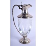 A 1990S SILVER MOUNTED ENGRAVED GLASS CLARET JUG decorated with grape vines and foliage. 27 cm high.