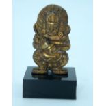 A small Chinese Tibetan gilt bronze Buddha mounted on a base. 6cm.