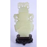 AN EARLY 20TH CENTURY CHINESE CARVED JADEITE VASE AND COVER Late Qing/Republic, carved with motifs.