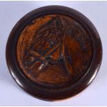 AN ANTIQUE TREEN HORSE HEAD EQUESTRIAN SNUFF BOX. 7.5 cm diameter.